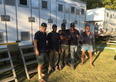 Mobi-Shower portable shower trailers set up at an outdoor event in South Africa