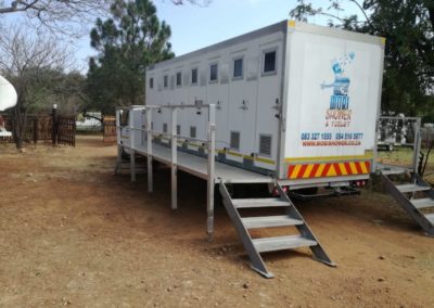 Mobi-Shower portable shower trailers set up at an outdoor event in South Africa