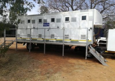 Mobi-Shower portable shower trailers set up at an outdoor event in South Africa