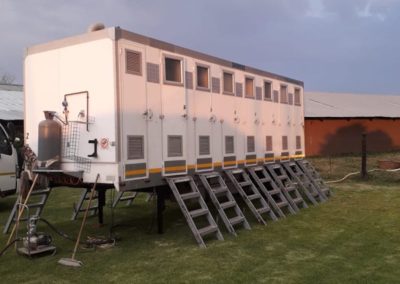 Mobi-Shower portable shower trailers set up at an outdoor event in South Africa