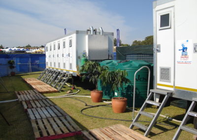 Mobi-Shower portable shower trailers set up at an outdoor event in South Africa