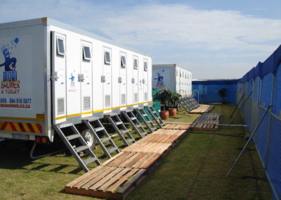 Mobi-Shower portable shower trailers set up at an outdoor event in South Africa