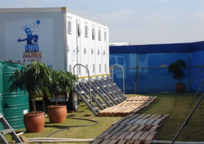 Mobi-Shower portable shower trailers set up at an outdoor event in South Africa