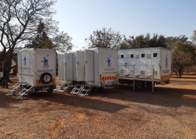 Mobi-Shower portable shower trailers set up at an outdoor event in South Africa
