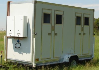 Mobi-Shower portable shower trailers set up at an outdoor event in South Africa