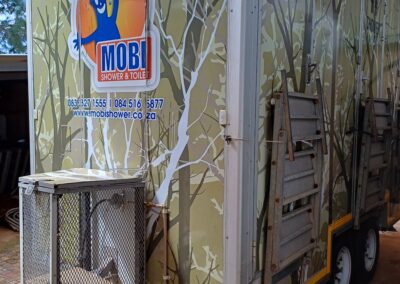 Mobi-Shower portable shower trailers set up at an outdoor event in South Africa. Portable showers and toilet hire services.