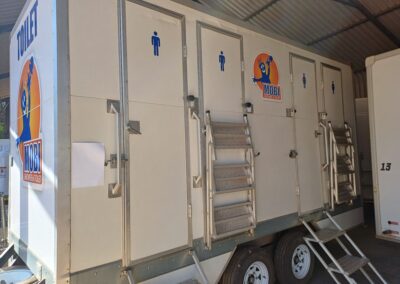 Mobi-Shower portable shower trailers set up at an outdoor event in South Africa. Portable showers and toilet hire services.