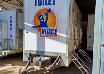 Mobi-Shower portable shower trailers set up at an outdoor event in South Africa. Portable showers and toilet hire services.