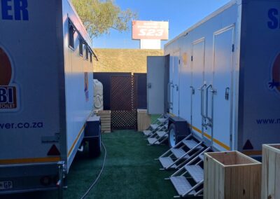 Mobi-Shower portable shower trailers set up at an outdoor event in South Africa. Portable showers and toilet hire services.