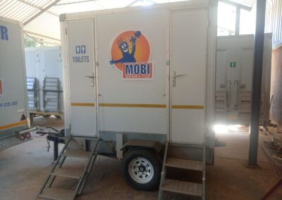 Mobi-Shower portable shower trailers set up at an outdoor event in South Africa. Portable showers and toilet hire services.